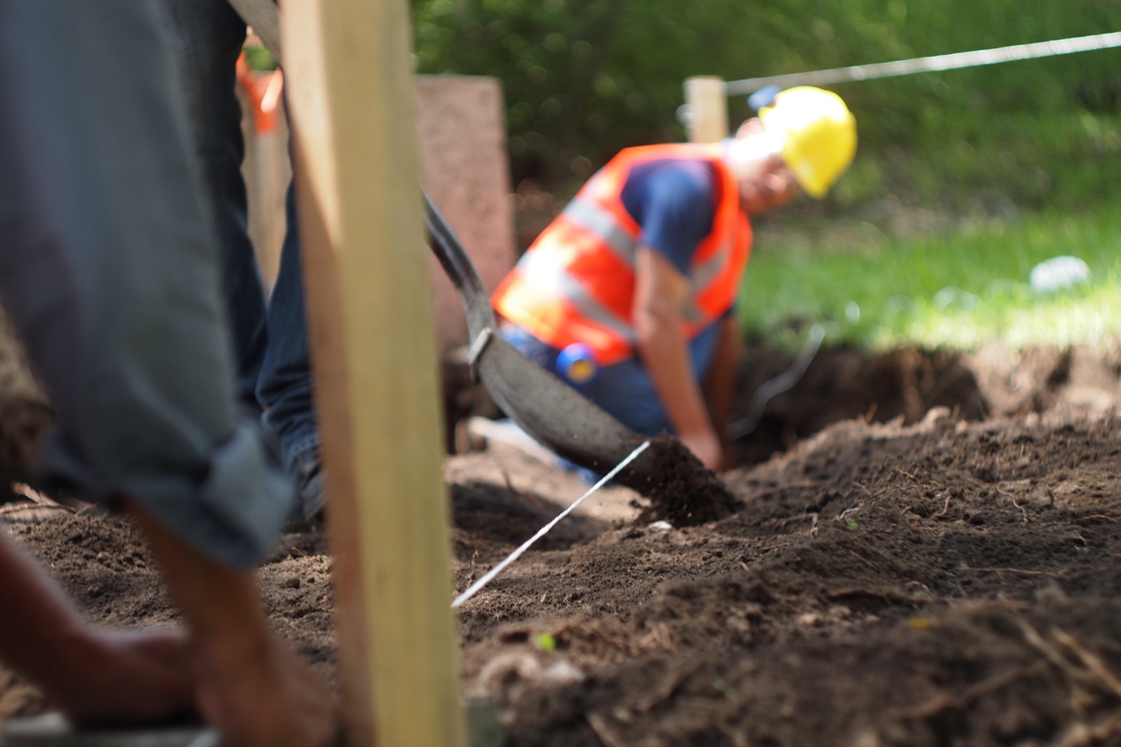 A worker digging the foundation trench